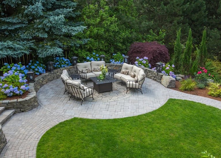 a patio with a fire pit and a fire pit